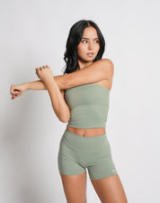 OJA Wear | A woman wearing a sage green bandeau top and matching shorts. The bandeau top is strapless and the shorts fall mid-thigh. | Premium Activewear & Athleisure Philippines