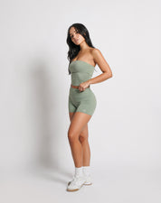 OJA Wear | A woman wearing a sage green bandeau top and matching shorts. The bandeau top is strapless and the shorts fall mid-thigh. | Premium Activewear & Athleisure Philippines