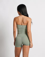 OJA Wear | A woman wearing a sage green bandeau top and matching shorts. The bandeau top is strapless and the shorts fall mid-thigh. | Premium Activewear & Athleisure Philippines