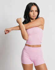 OJA Wear | A woman wearing a blush pink bandeau top and matching shorts. The bandeau top is strapless and the shorts fall mid-thigh. | Premium Activewear & Athleisure Philippines