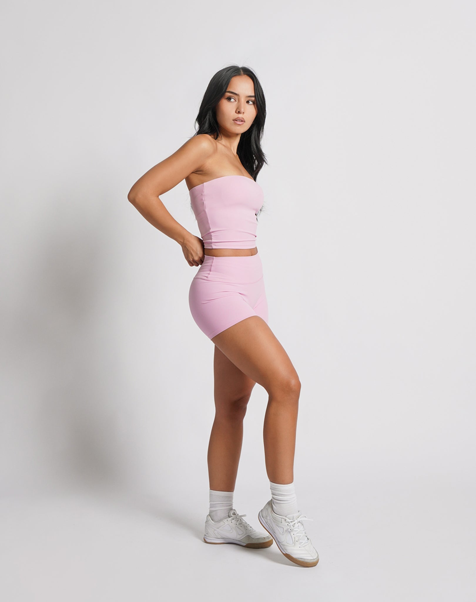 OJA Wear | A woman wearing a blush pink bandeau top and matching shorts. The bandeau top is strapless and the shorts fall mid-thigh. | Premium Activewear & Athleisure Philippines
