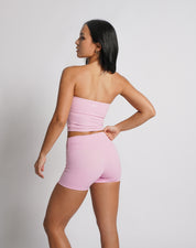 OJA Wear | A woman wearing a blush pink bandeau top and matching shorts. The bandeau top is strapless and the shorts fall mid-thigh. | Premium Activewear & Athleisure Philippines