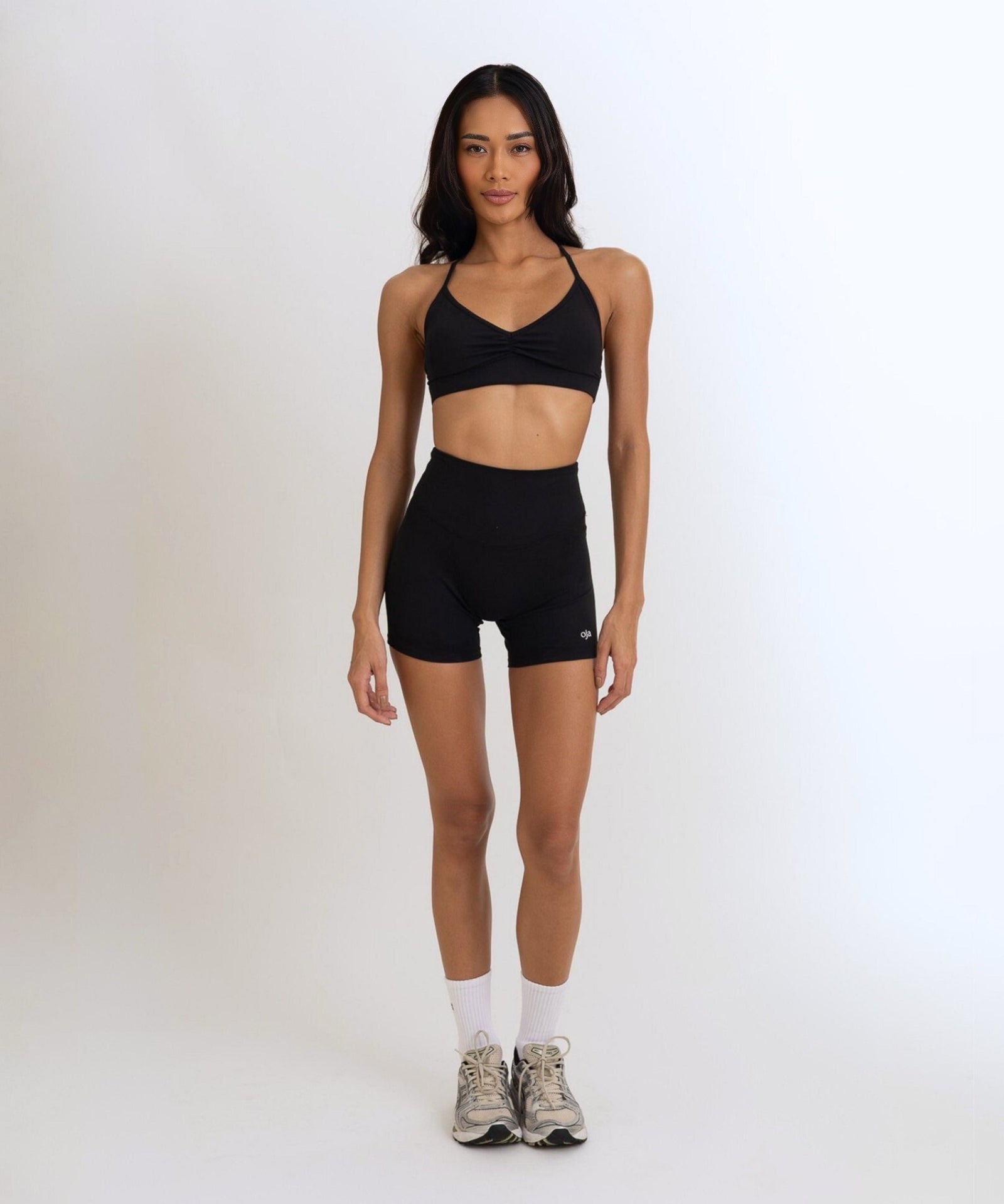 Front view of the Model Wearing a black Color Ease Form Shorts From OJA Wear Philippines - Activewear & Athleisure for Pilates and Workouts