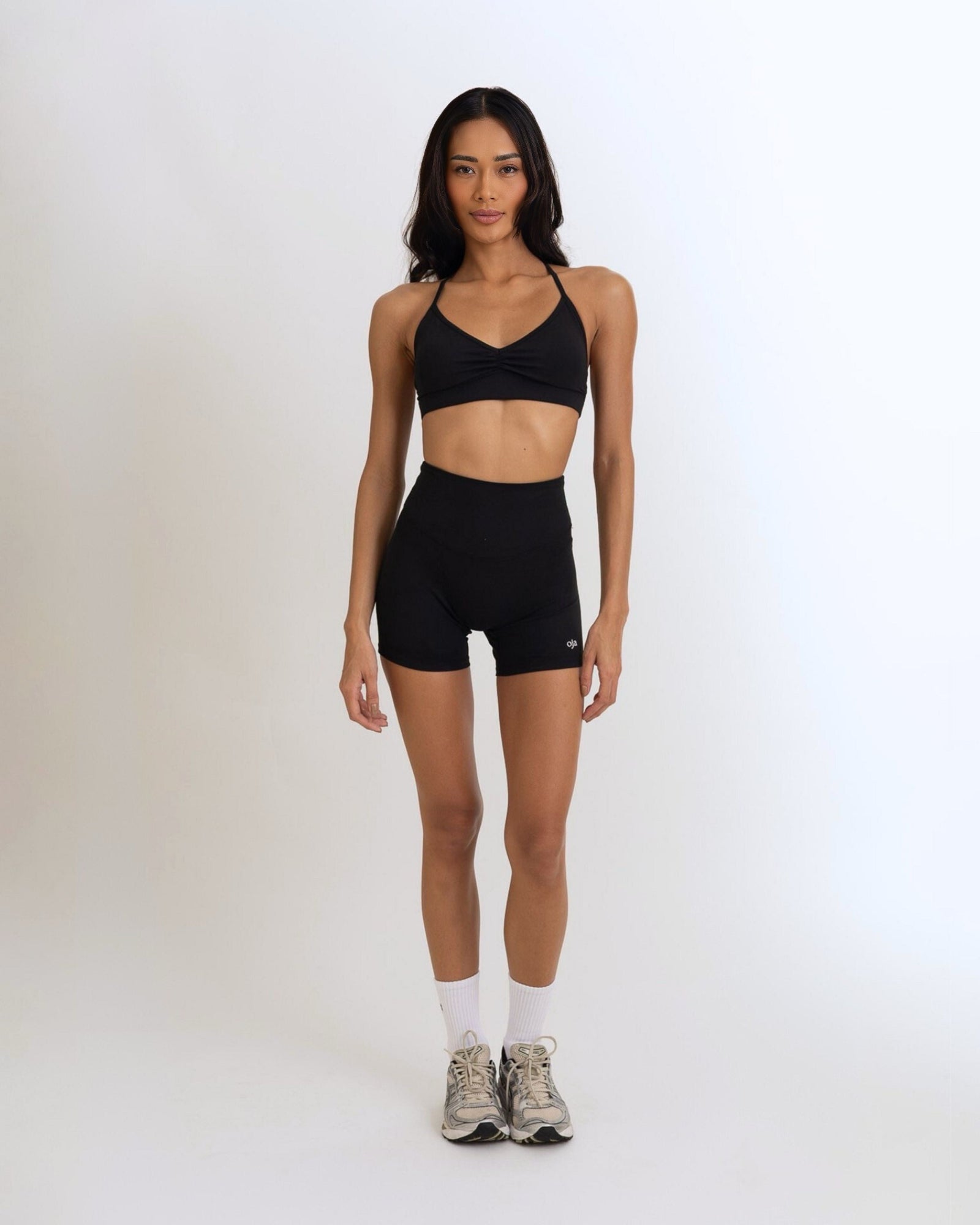 Front view of the Model Wearing a black Color Ease Form Shorts From OJA Wear Philippines - Activewear &amp; Athleisure for Pilates and Workouts