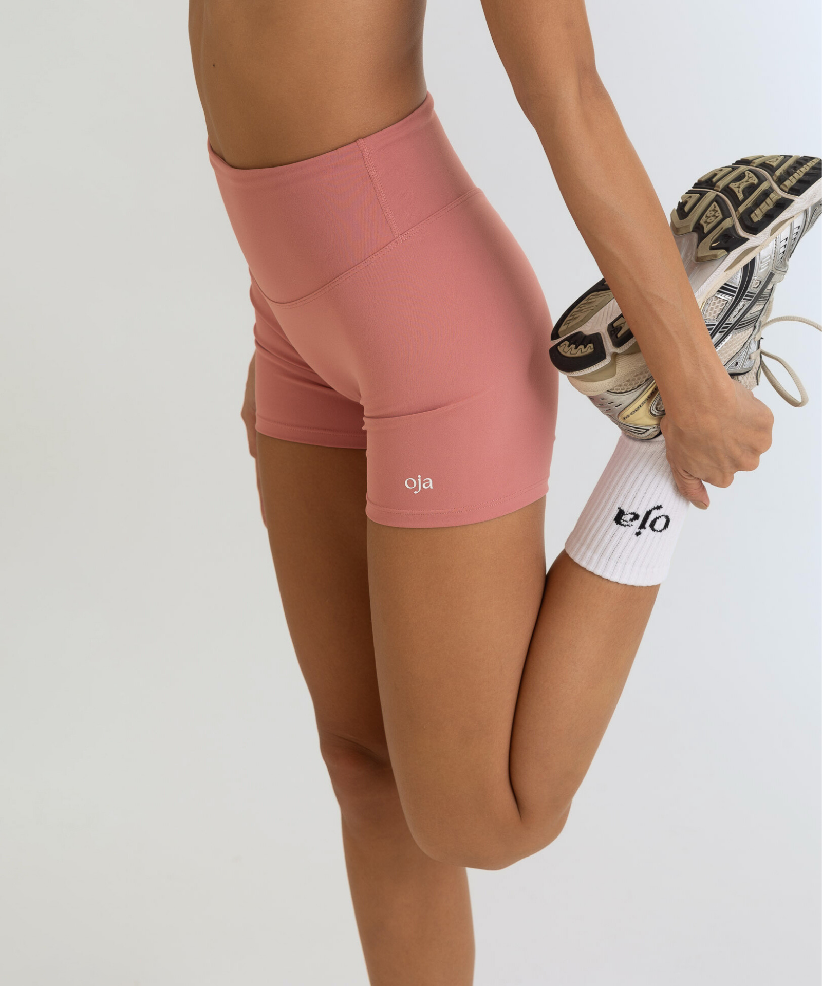 Zoom view of Dusty Pink Color Ease Form Shorts From with Silicone White Logo, OJA Wear Philippines - Activewear & Athleisure for Pilates and Workouts