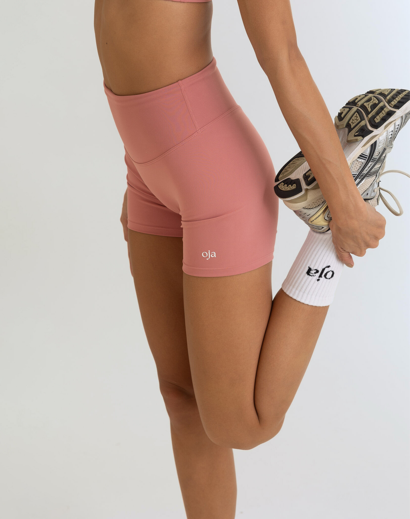 Zoom view of Dusty Pink Color Ease Form Shorts From with Silicone White Logo, OJA Wear Philippines - Activewear & Athleisure for Pilates and Workouts