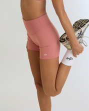 Zoom view of Dusty Pink Color Ease Form Shorts From with Silicone White Logo, OJA Wear Philippines - Activewear & Athleisure for Pilates and Workouts