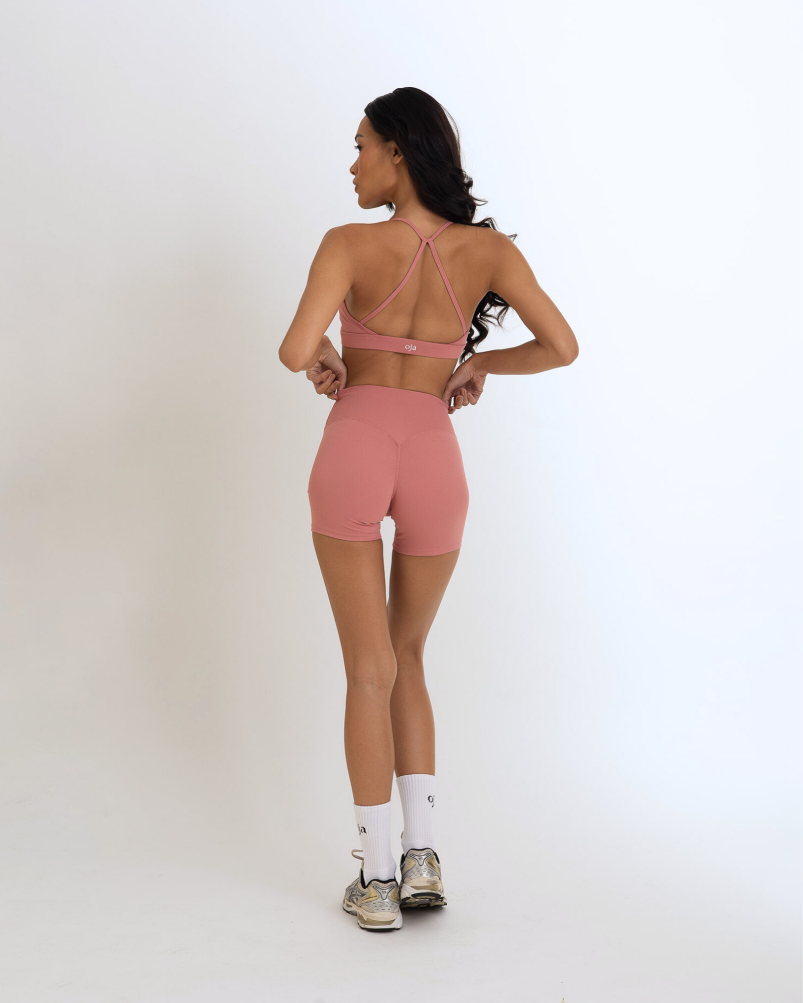 Back view of the Model Wearing a Dusty Pink Color Ease Form Shorts From OJA Wear Philippines - Activewear & Athleisure for Pilates and Workouts