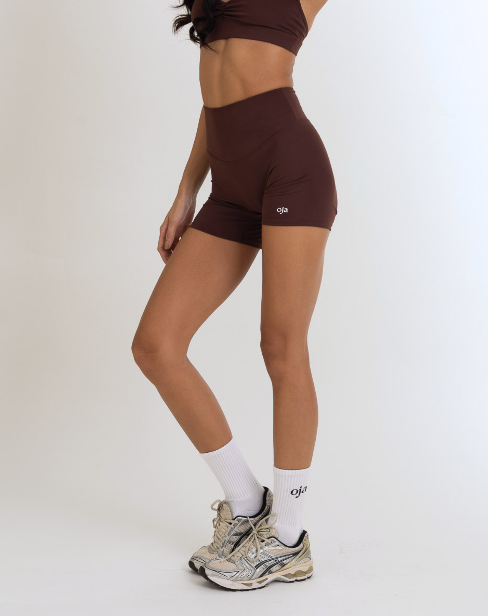 front view of the Model Wearing espresso Color Ease Form Shorts From OJA Wear Philippines - Activewear & Athleisure for Pilates and Workouts