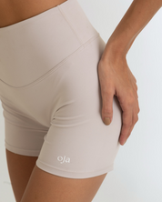 Zoom view of Grey White Color Ease Form Shorts From with Silicone White Logo, OJA Wear Philippines - Activewear & Athleisure for Pilates and Workouts